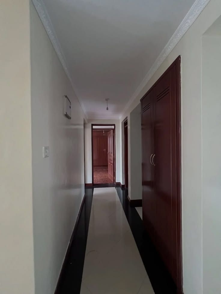 Hallway with fitted wardrobes