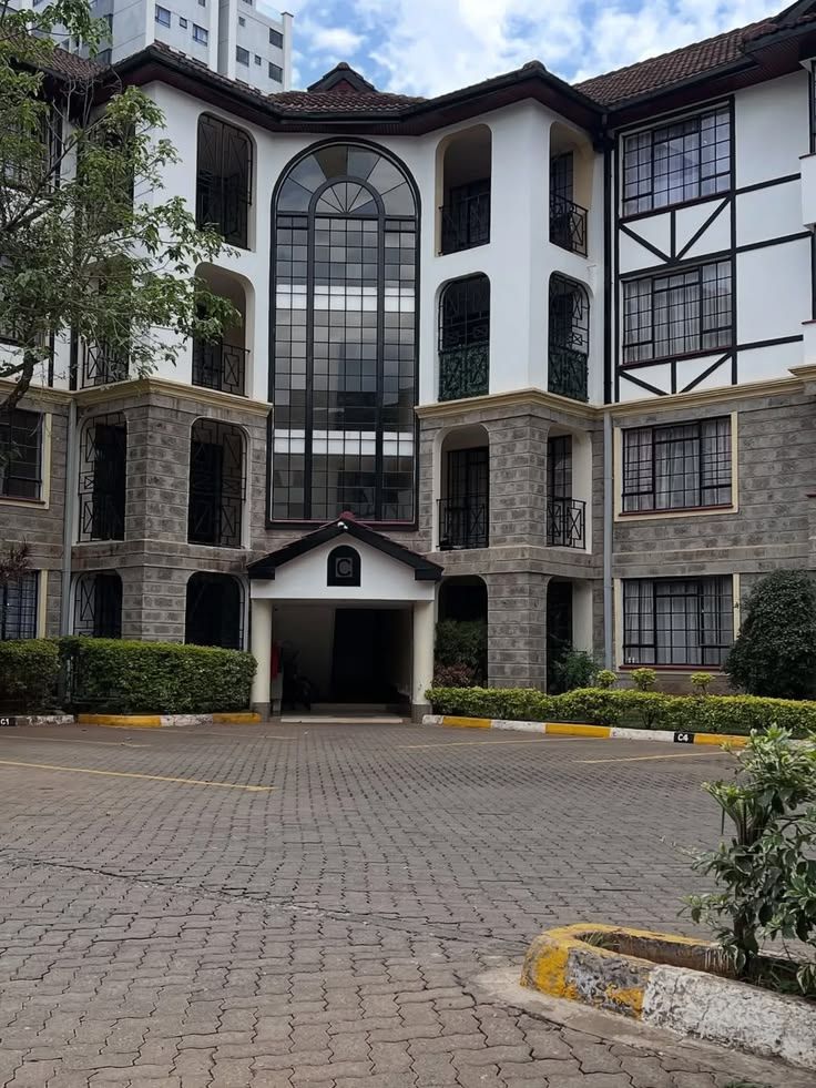 Crystal Heights — stone-clad apartments around a gated courtyard in Naivasha