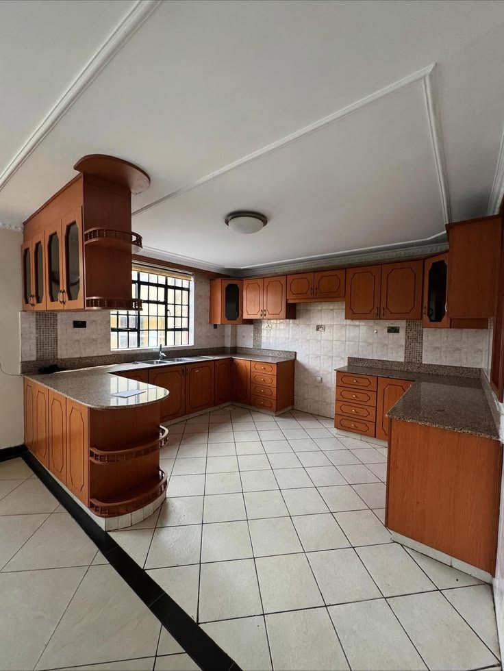 Large fitted kitchen with granite counters